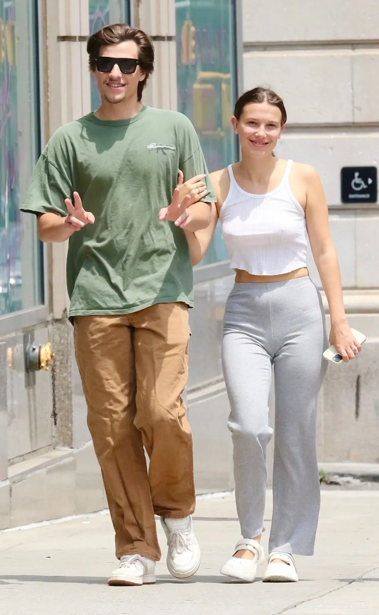 Millie Bobby Brown Stills in White Top Blue jeans in New York